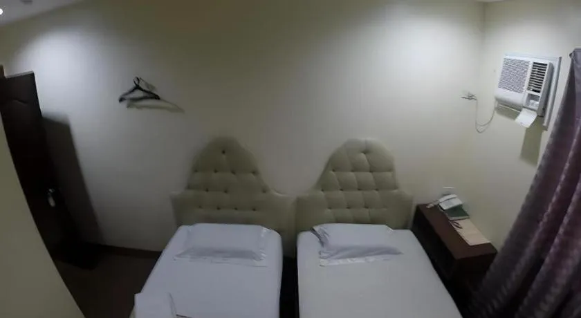 Bed in Rich Manor Pension House