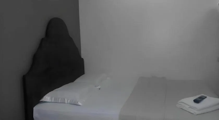 Bed in Rich Manor Pension House