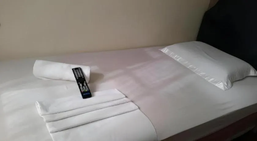 Bed in Rich Manor Pension House