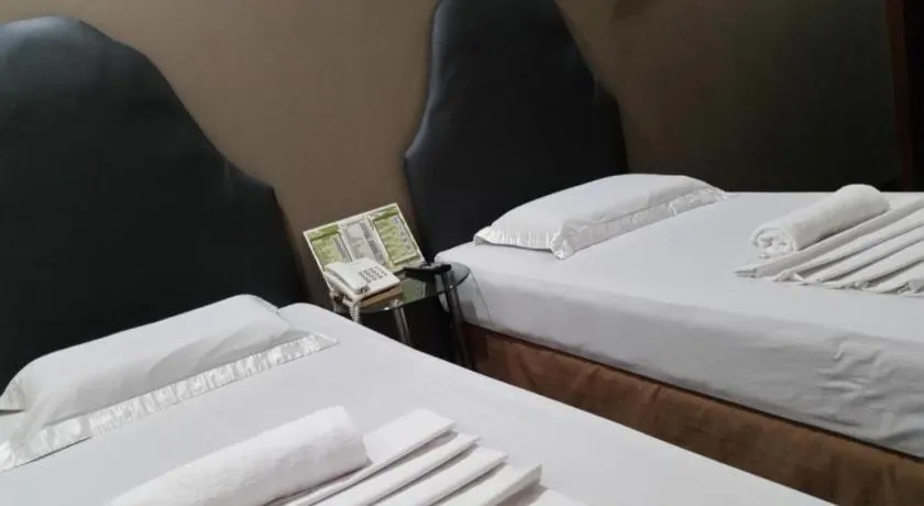 Bed in Rich Manor Pension House