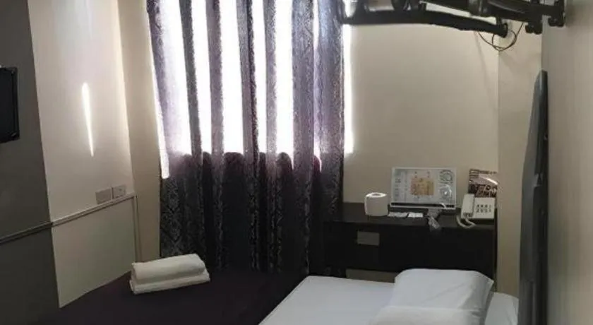 Bed in Rich Manor Pension House