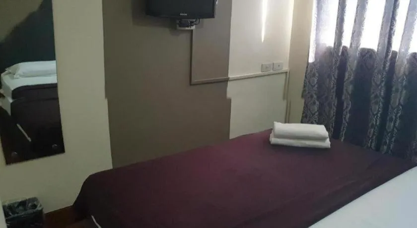 Bed in Rich Manor Pension House