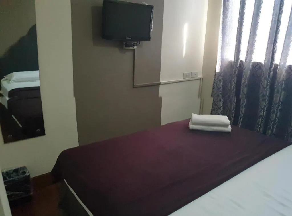 Bed in Rich Manor Pension House