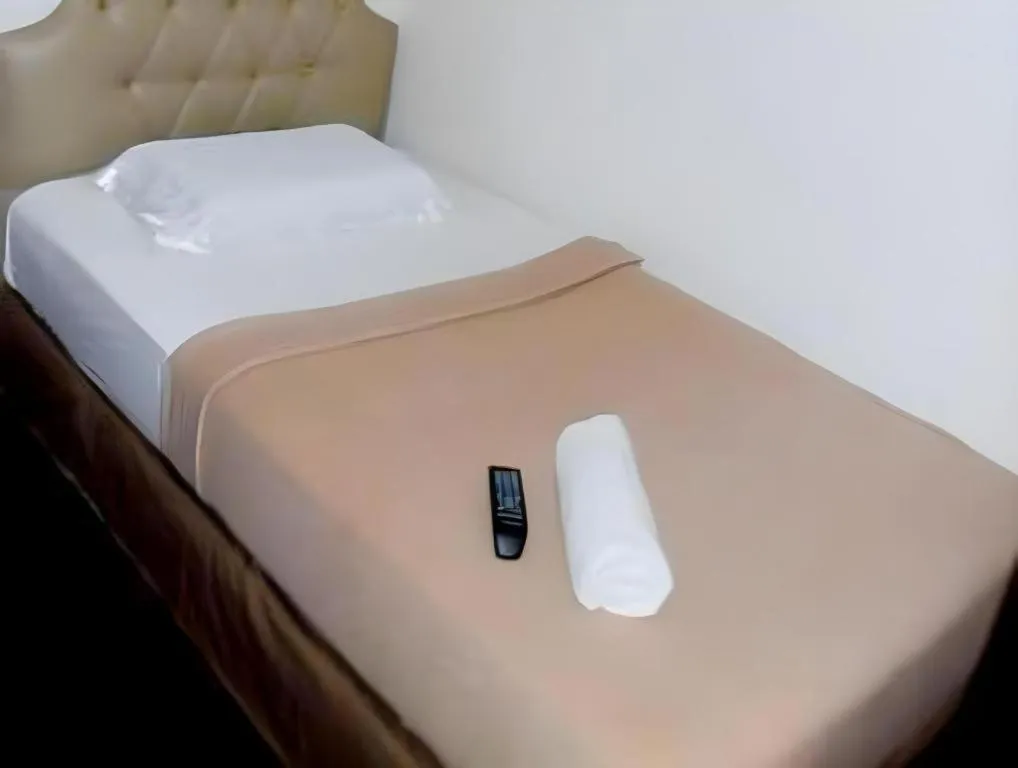 Bed in Rich Manor Pension House