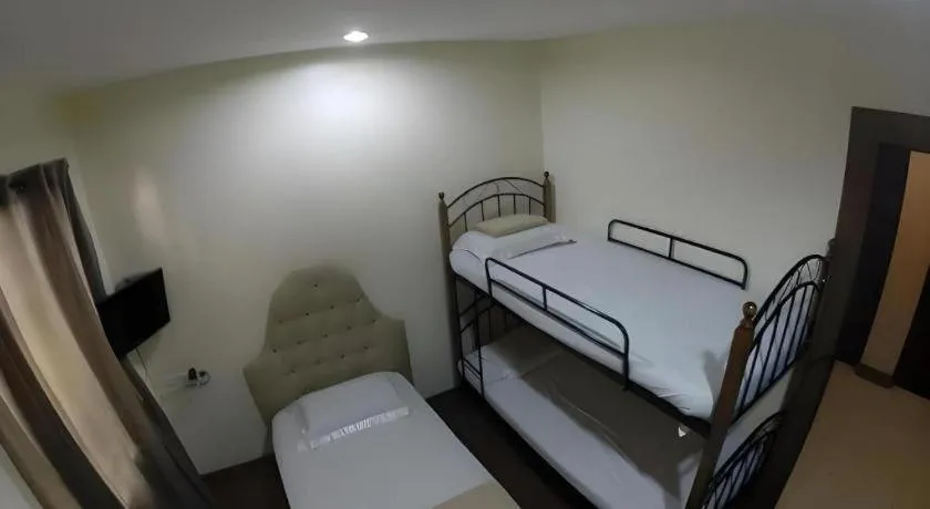 Bed in Rich Manor Pension House