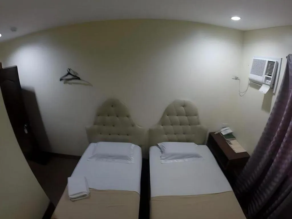 Bed in Rich Manor Pension House