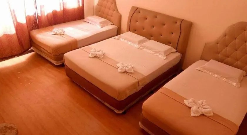 Bed in Rich Manor Pension House