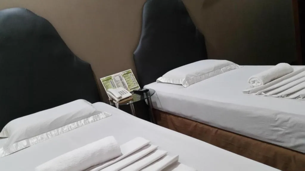 Bed in Rich Manor Pension House