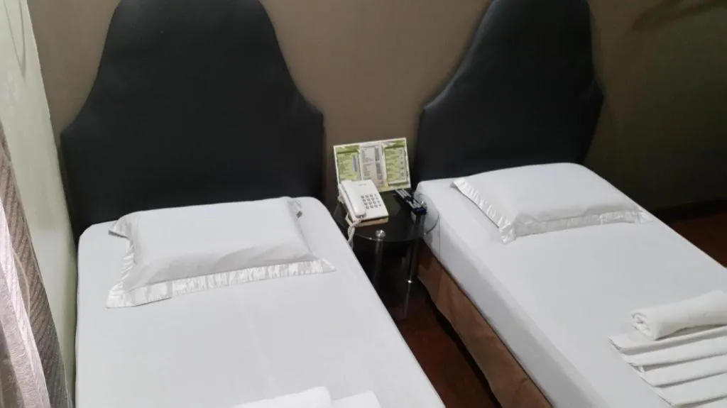 Bed in Rich Manor Pension House