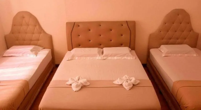 Bed in Rich Manor Pension House