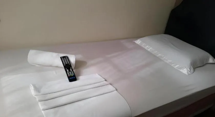 Bed in Rich Manor Pension House