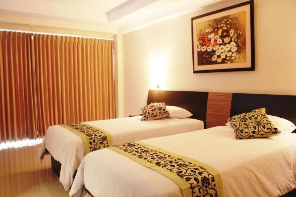 Bed in Losari Sunset Hotel