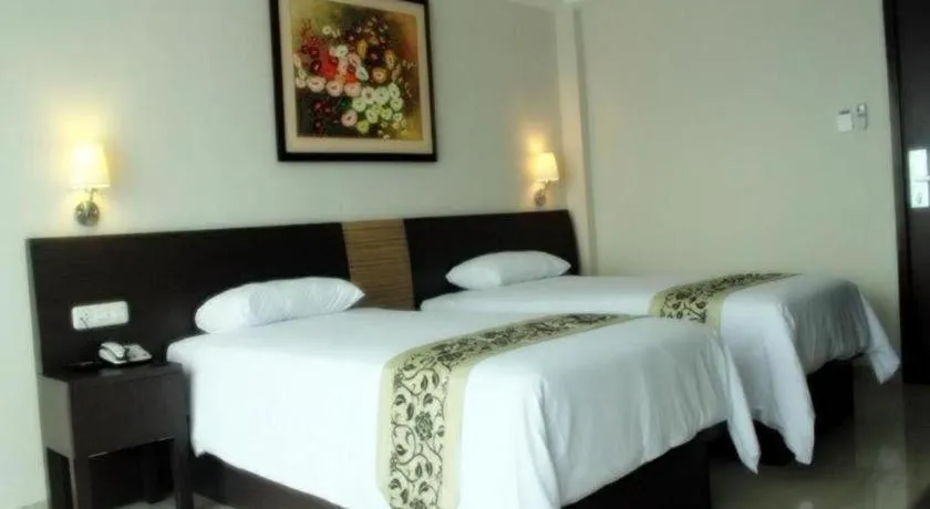 Bed in Losari Sunset Hotel