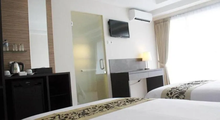 Bed in Losari Sunset Hotel