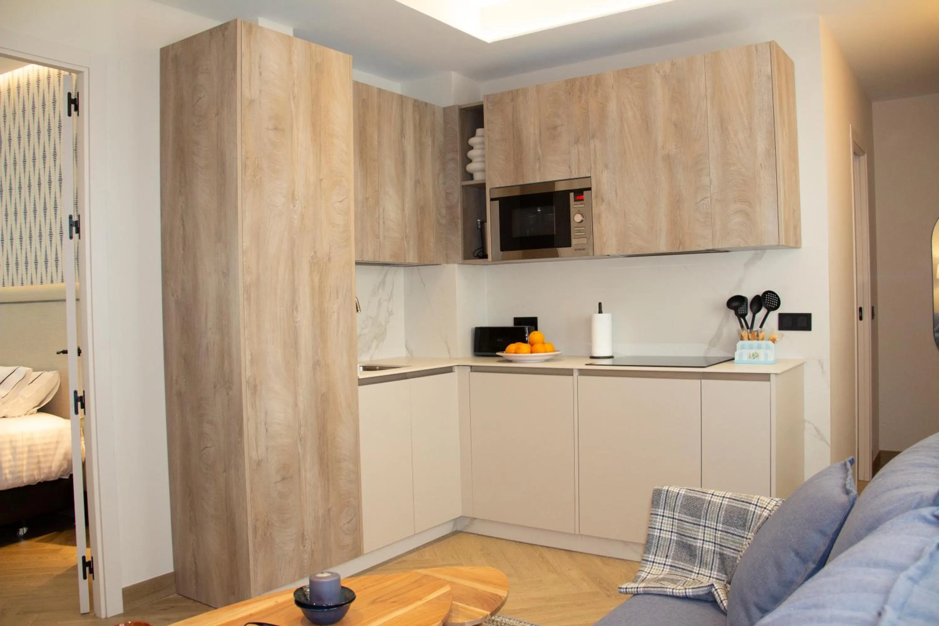 Bed in Puerta de la Ribera Suites