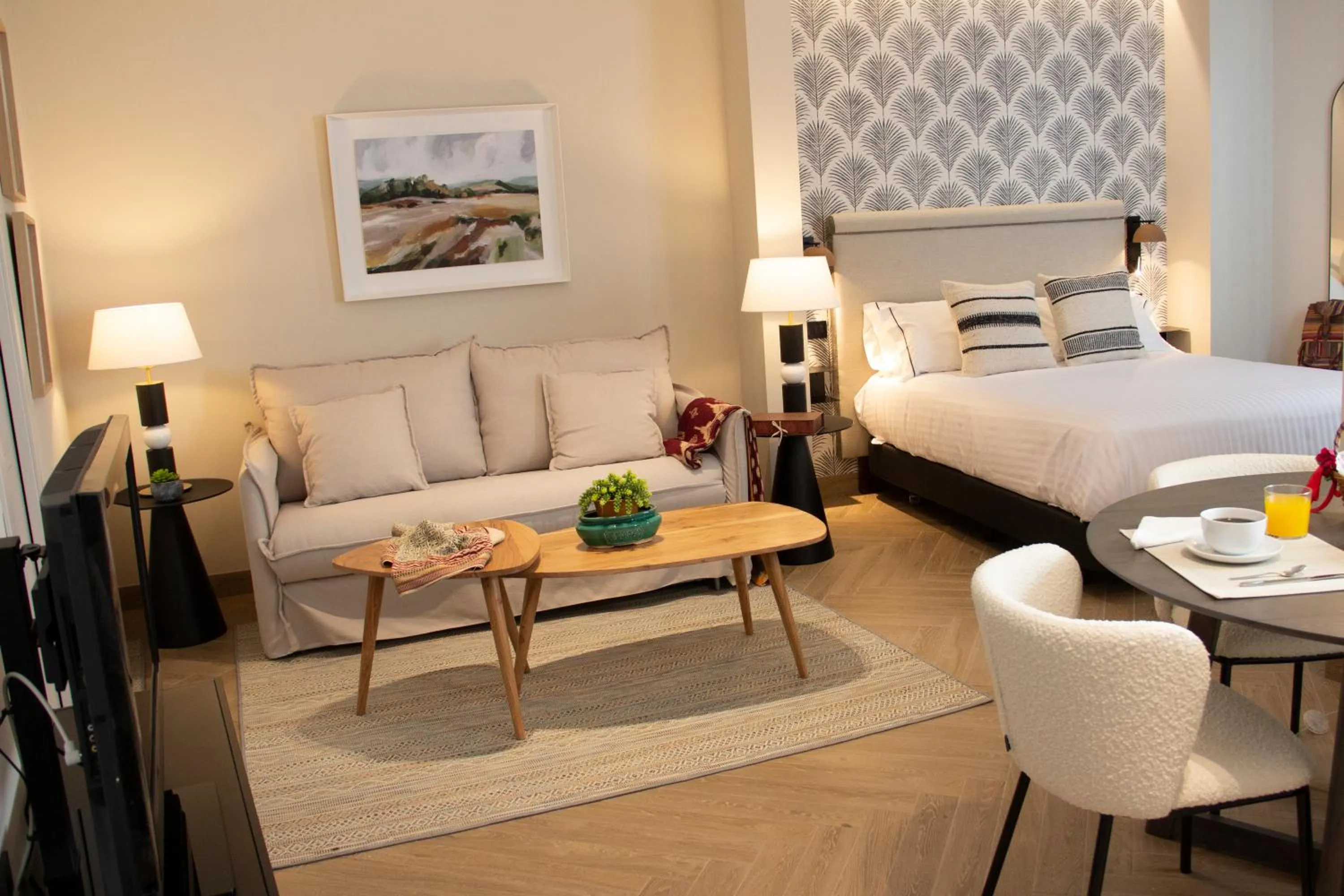 Bed in Puerta de la Ribera Suites