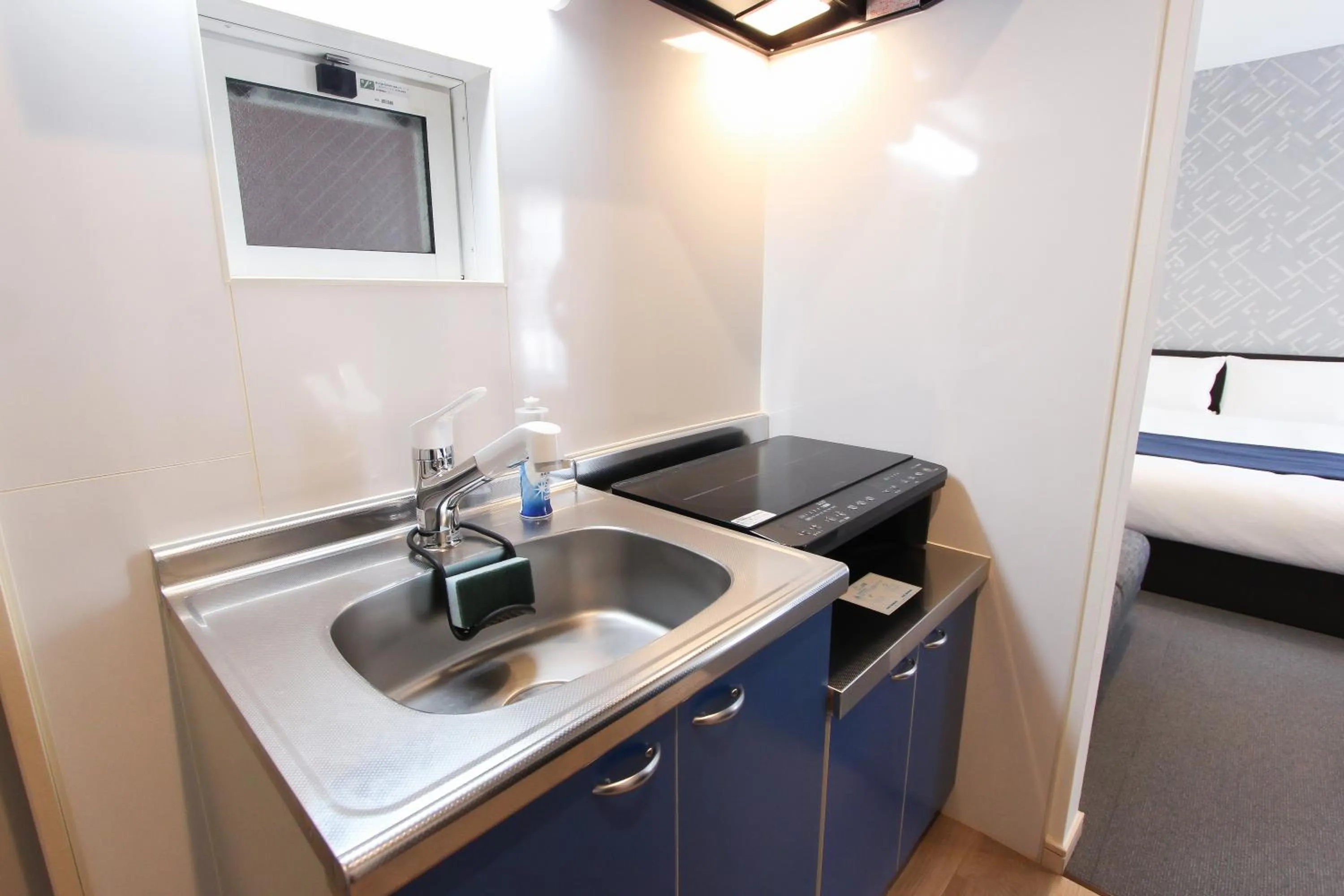 kitchen, Bed in Hotel SALIFORT HAKATA