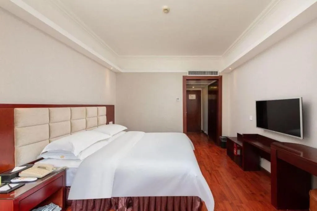 Bed in Overseas Chinese Hotel