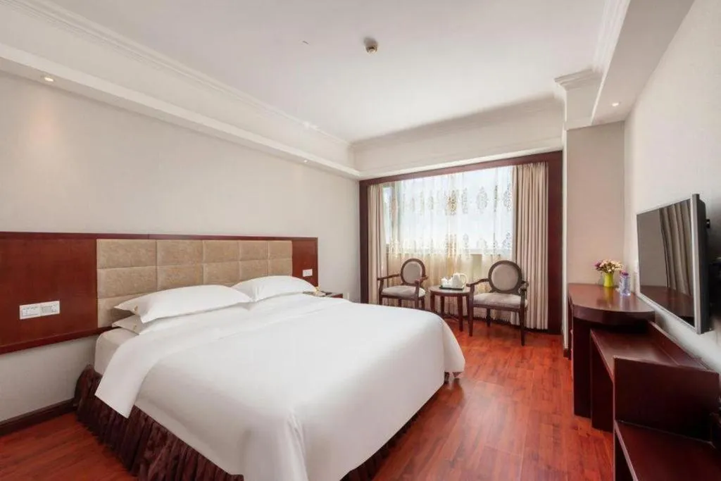 Bed in Overseas Chinese Hotel