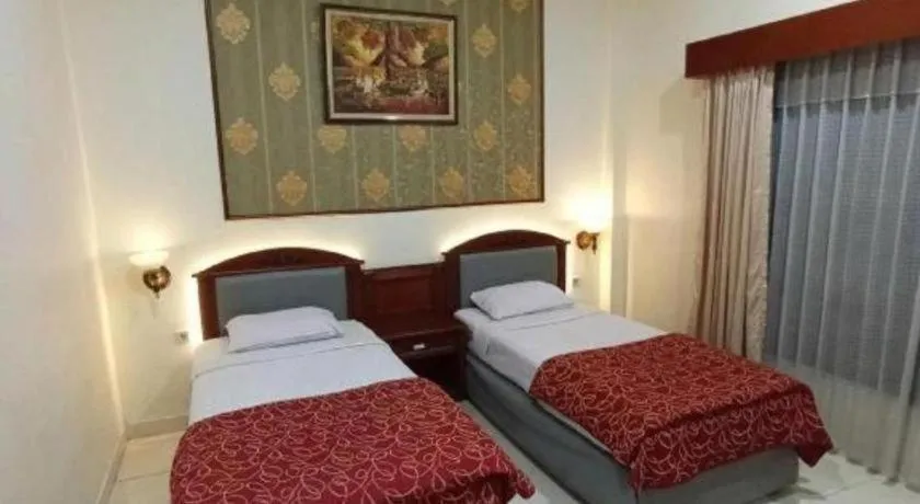 Bed in Larisae Setia Kawan Hotel