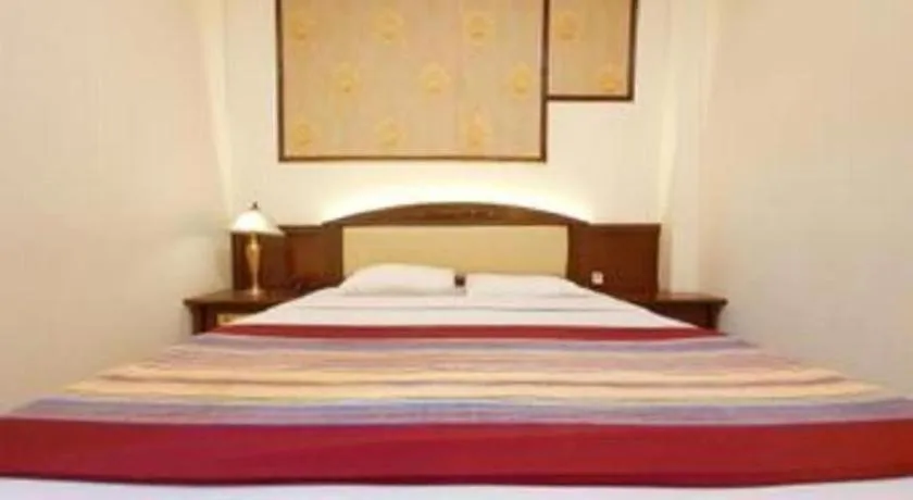 Bed in Larisae Setia Kawan Hotel