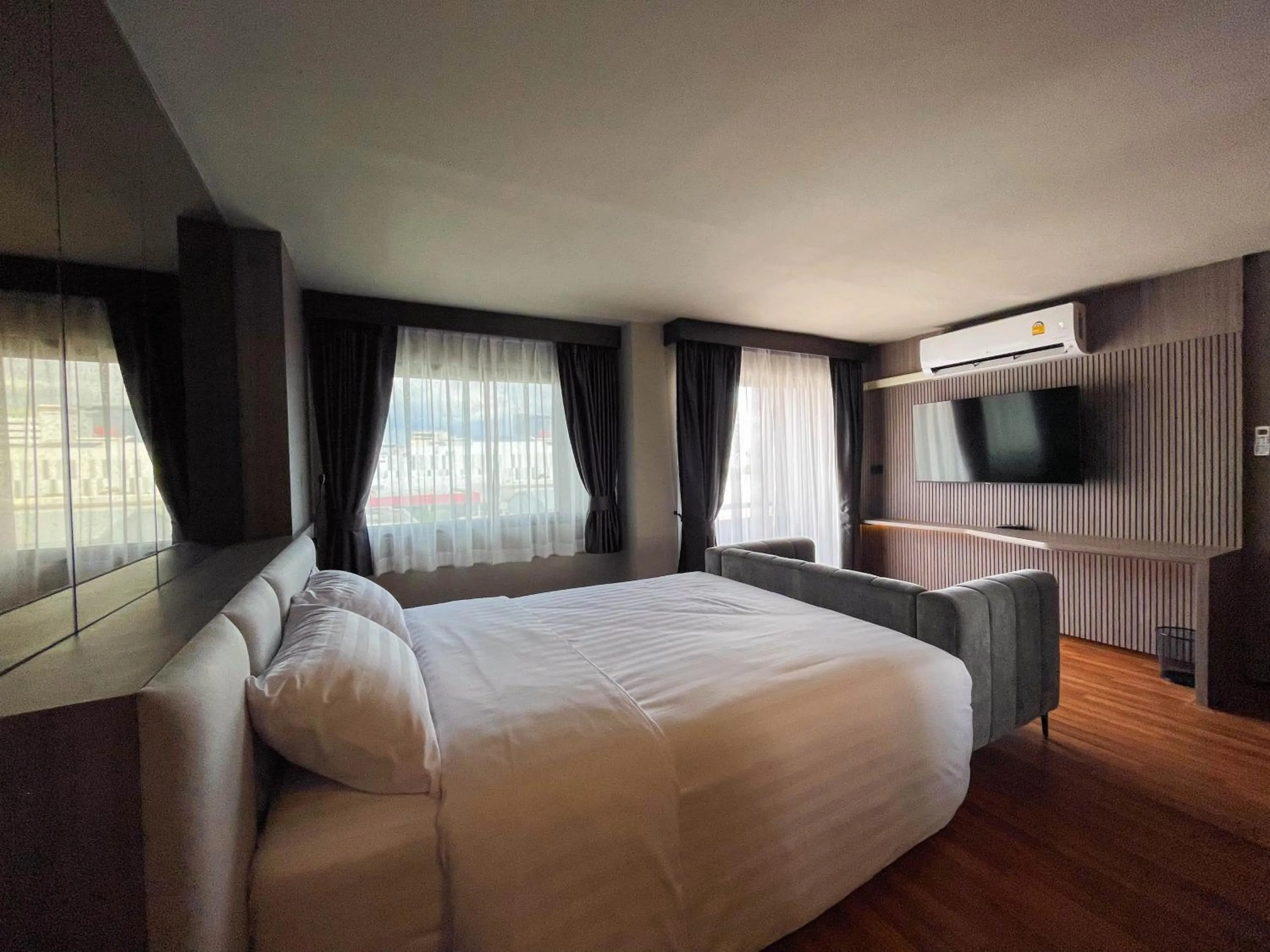 Living room, Bed in We Hotel