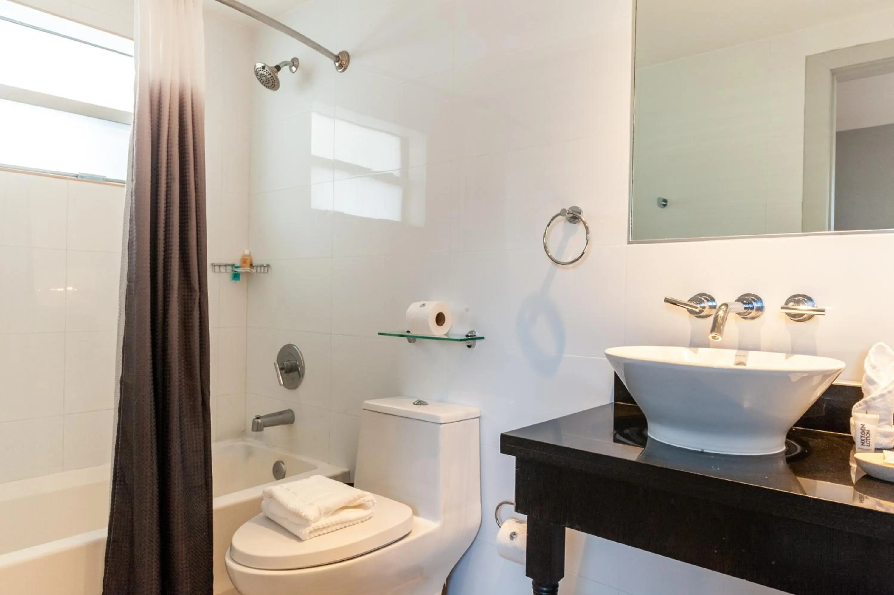 Shower in Seaside All Suites Hotel