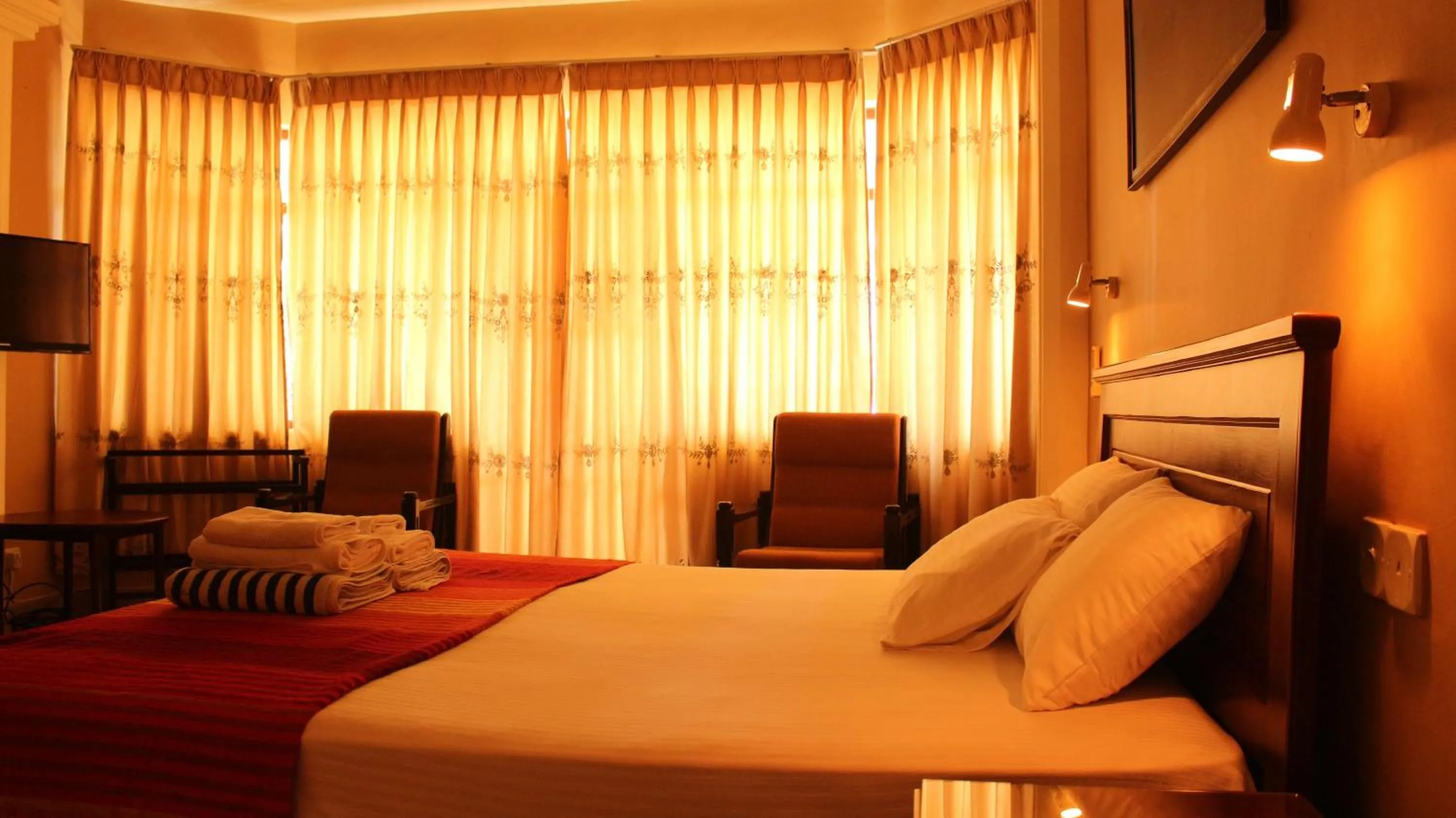 Photo of the whole room, Bed in Janishi Residencies