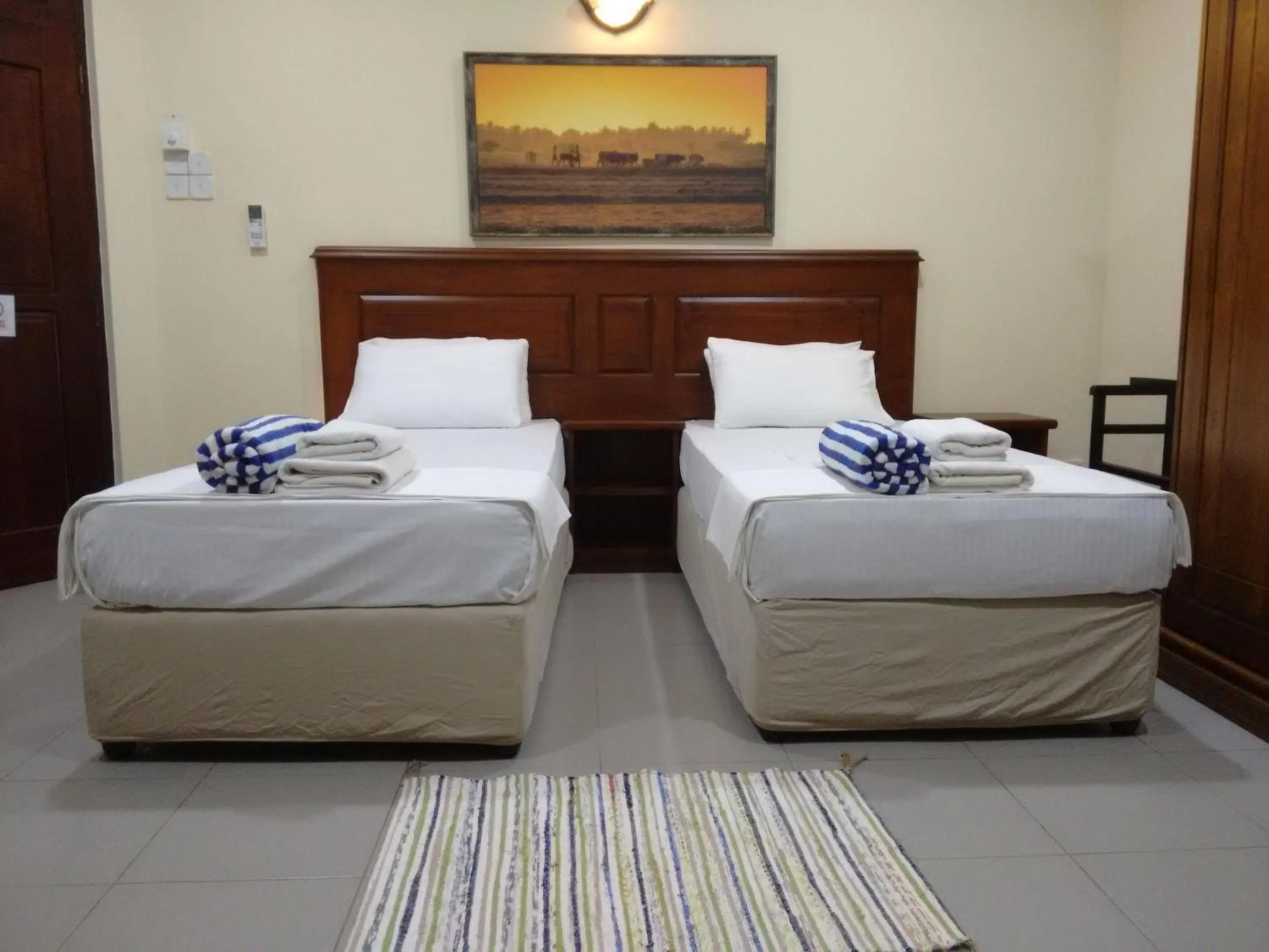 Photo of the whole room, Bed in Janishi Residencies