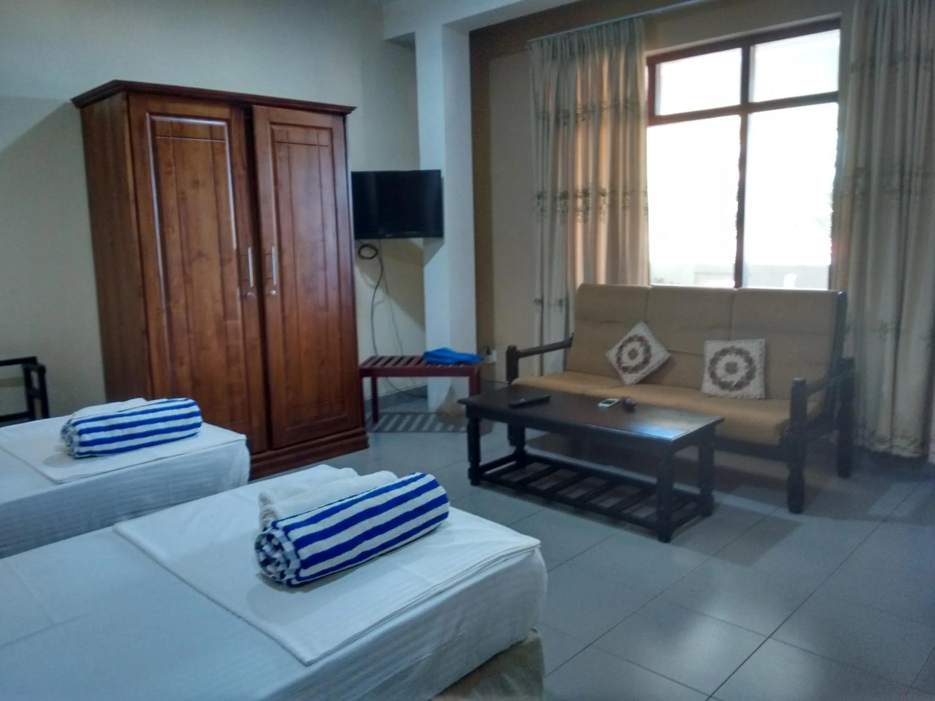 Photo of the whole room, Bed in Janishi Residencies