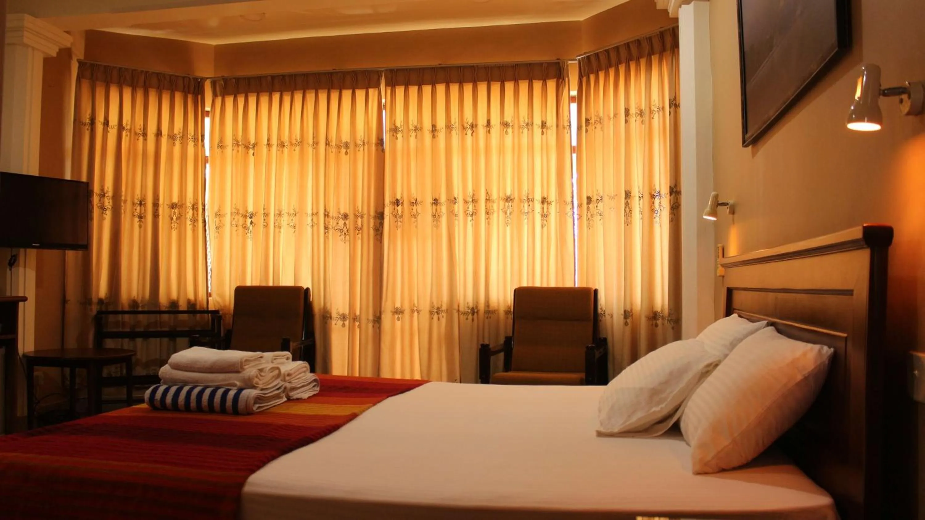 Photo of the whole room, Bed in Janishi Residencies