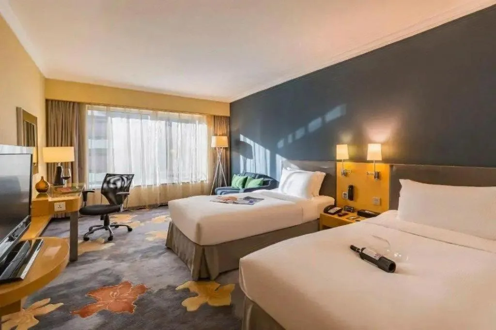 Bed in Beijing New World Center Tongpai Hotel