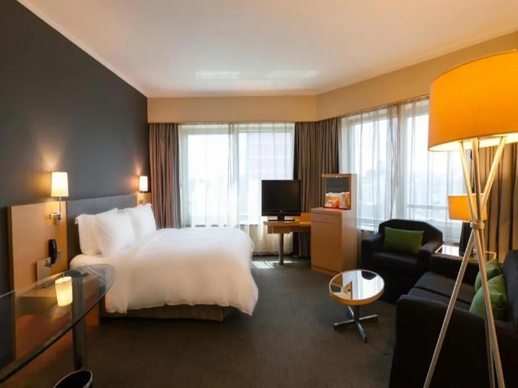 Bed in Beijing New World Center Tongpai Hotel