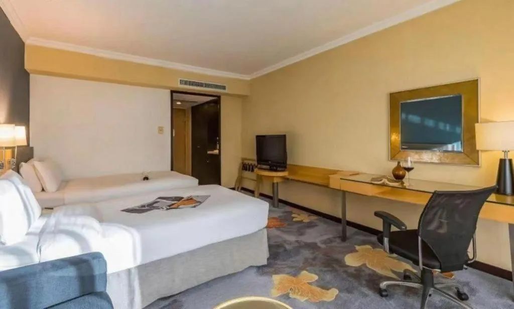 Bed in Beijing New World Center Tongpai Hotel