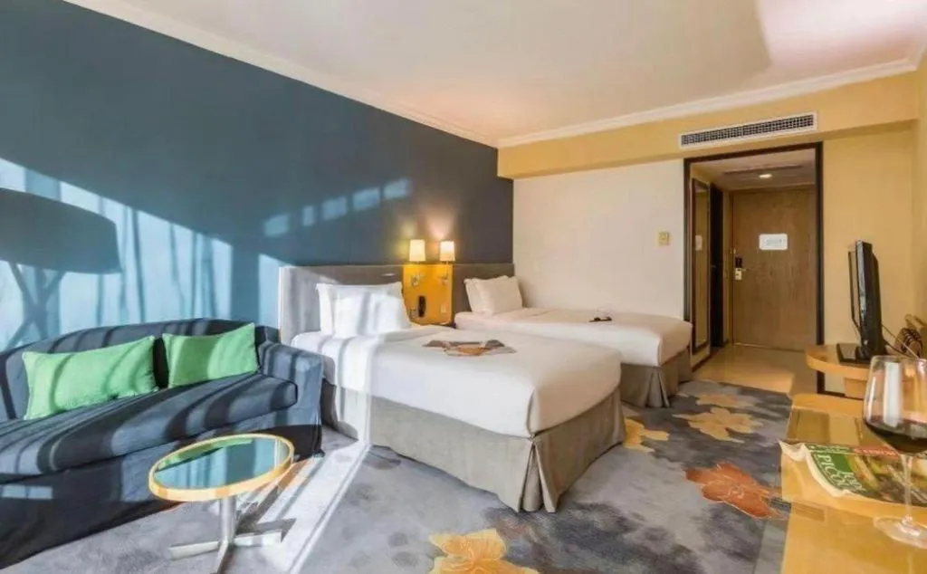 Bed in Beijing New World Center Tongpai Hotel