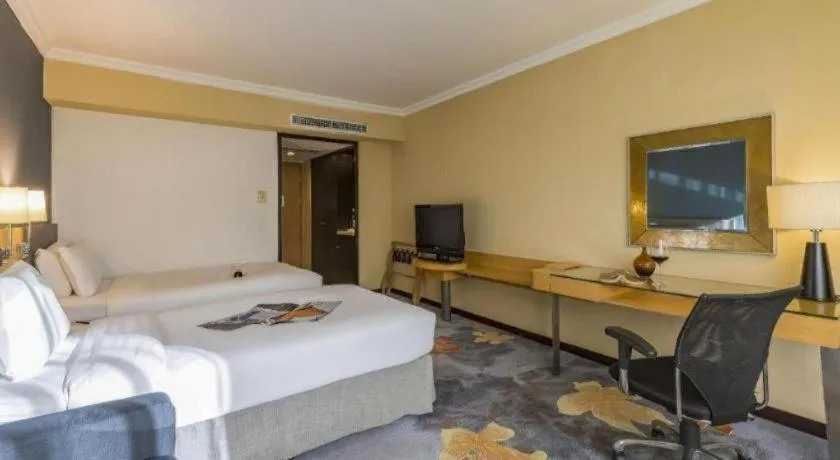 Bed in Beijing New World Center Tongpai Hotel