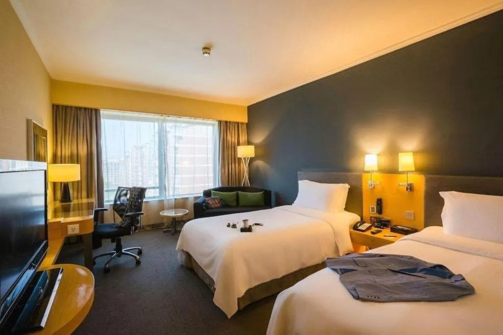 Bed in Beijing New World Center Tongpai Hotel