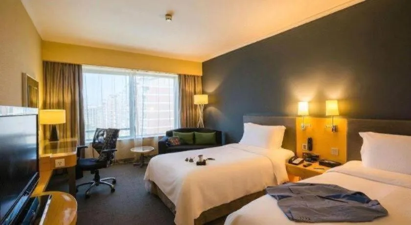 Bed in Beijing New World Center Tongpai Hotel