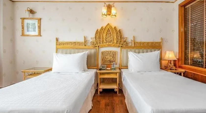 Bed in Senriver Hotel