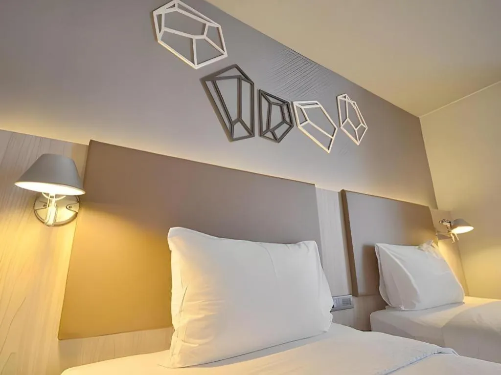 Bed in The Heritage Silom Hotel