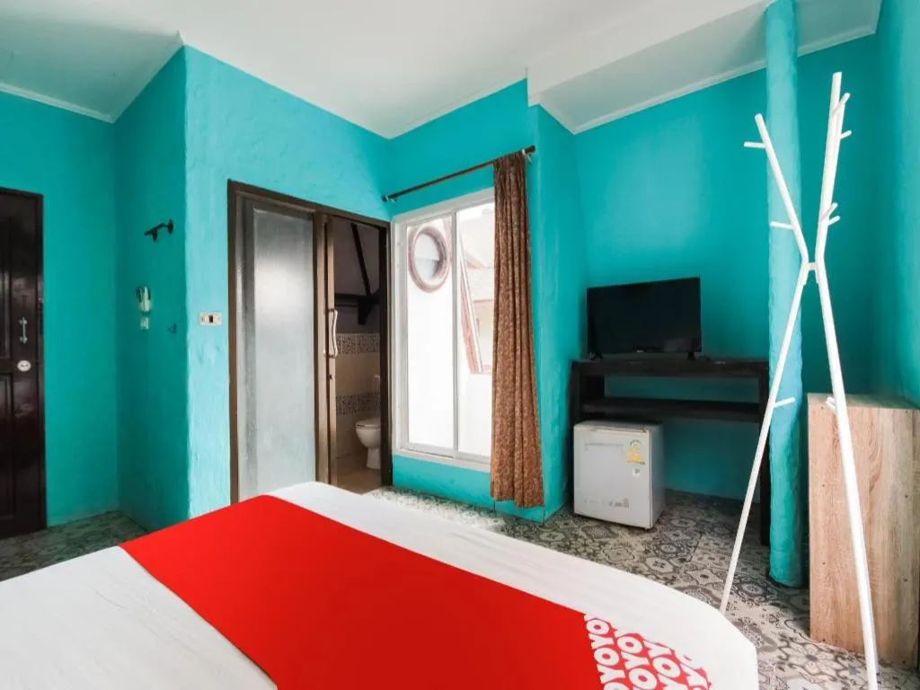 Bed in OYO 1103 Pirates House Hotel