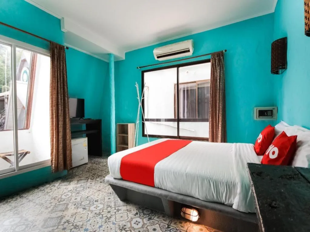 Bed in OYO 1103 Pirates House Hotel