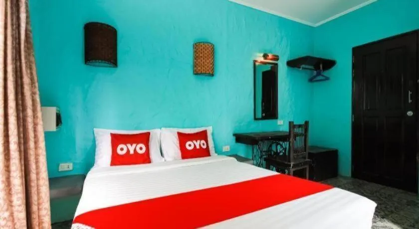 Bed in OYO 1103 Pirates House Hotel