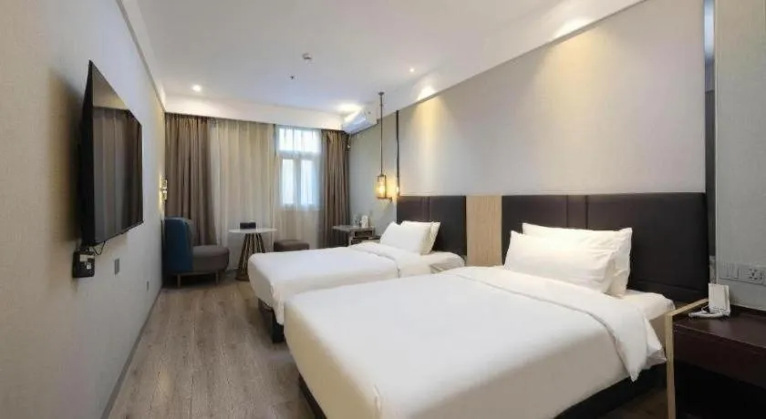 Bed in Magnotel Shanghai Maglev Station