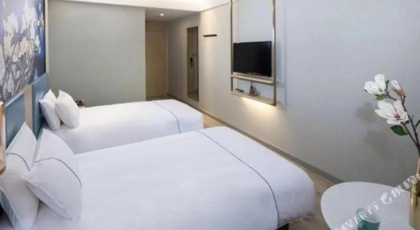 Bed in Magnotel Shanghai Maglev Station