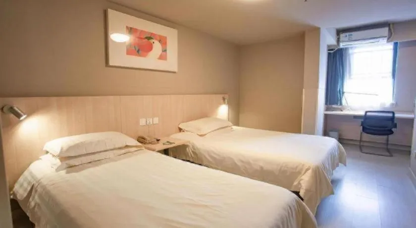 Bed in Jinjiang Inn Wuhu Fangte Tech Museum Metro Station