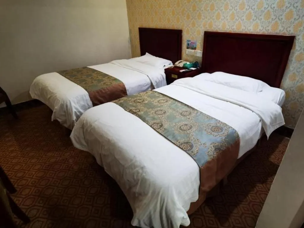 Bed in GreenTree Inn Suzhou Shengze Hotel