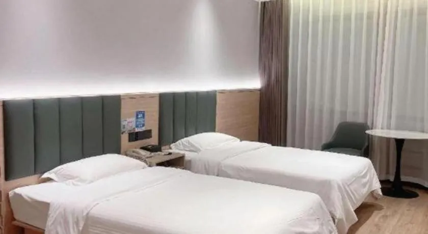 Bed in GreenTree Inn Suzhou Shengze Hotel