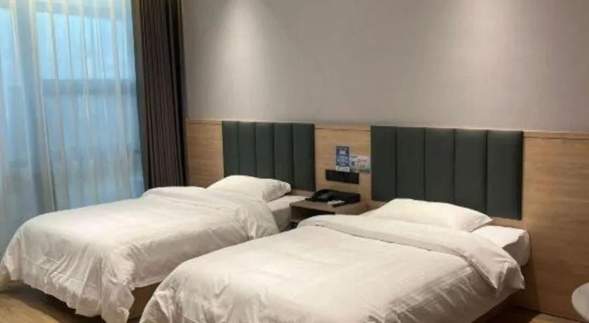 Bed in GreenTree Inn Suzhou Shengze Hotel