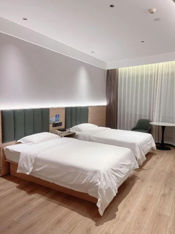 Bed in GreenTree Inn Suzhou Shengze Hotel